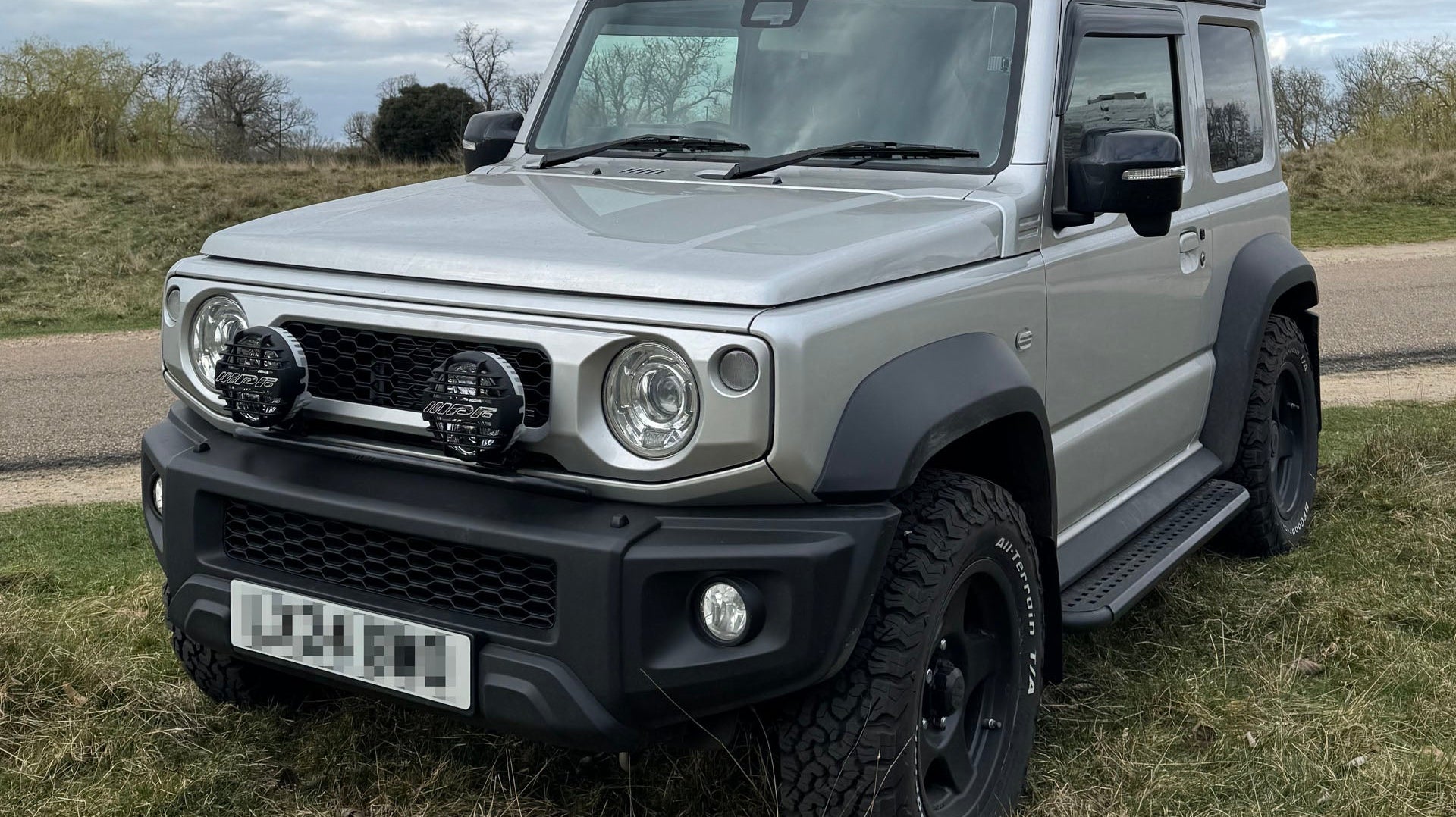 Silver Suzuki Jimny fitted with 16" BRADLEY V wheels and Clear LED Lighting