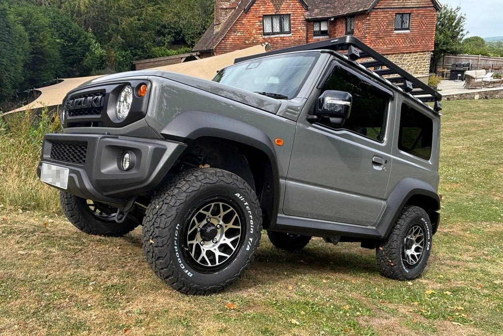 Suzuki Jimny (2018+) with Magpie M-01 wheels in Satin Black with Machined Face and BF Goodrich Tyres, Slimline II Roof Rack and Rear Ladder and Retro Grille with Tactical Badge